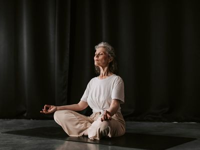 Person hands resting in a mudra position